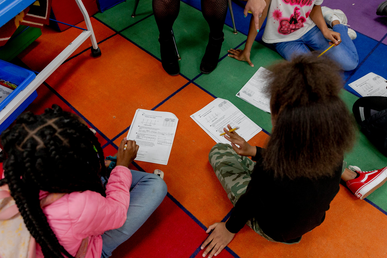 Students engaged in a small group tutoring session
