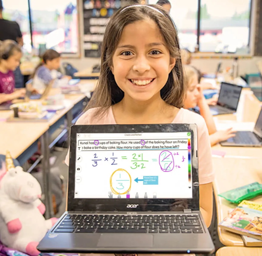 An elementary student showing a digitally illustrated math problem solution on a laptop using colorful annotations and visual highlights